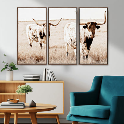 Two Texas longhorn cows standing in a sepia-toned pasture, evoking rustic charm perfect for farmhouse or western country interiors. (