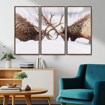 Two elk clashing antlers in a snowy forest, capturing raw power and wild energy, ideal for rustic cabin or lodge-style decor.