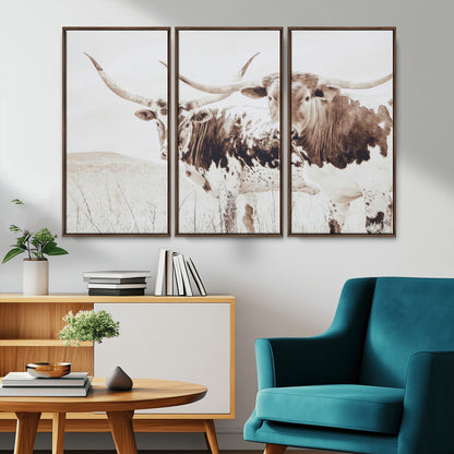 Two longhorn cows standing in a sepia-toned pasture with soft light, ideal for rustic or farmhouse-themed neutral wall decor.