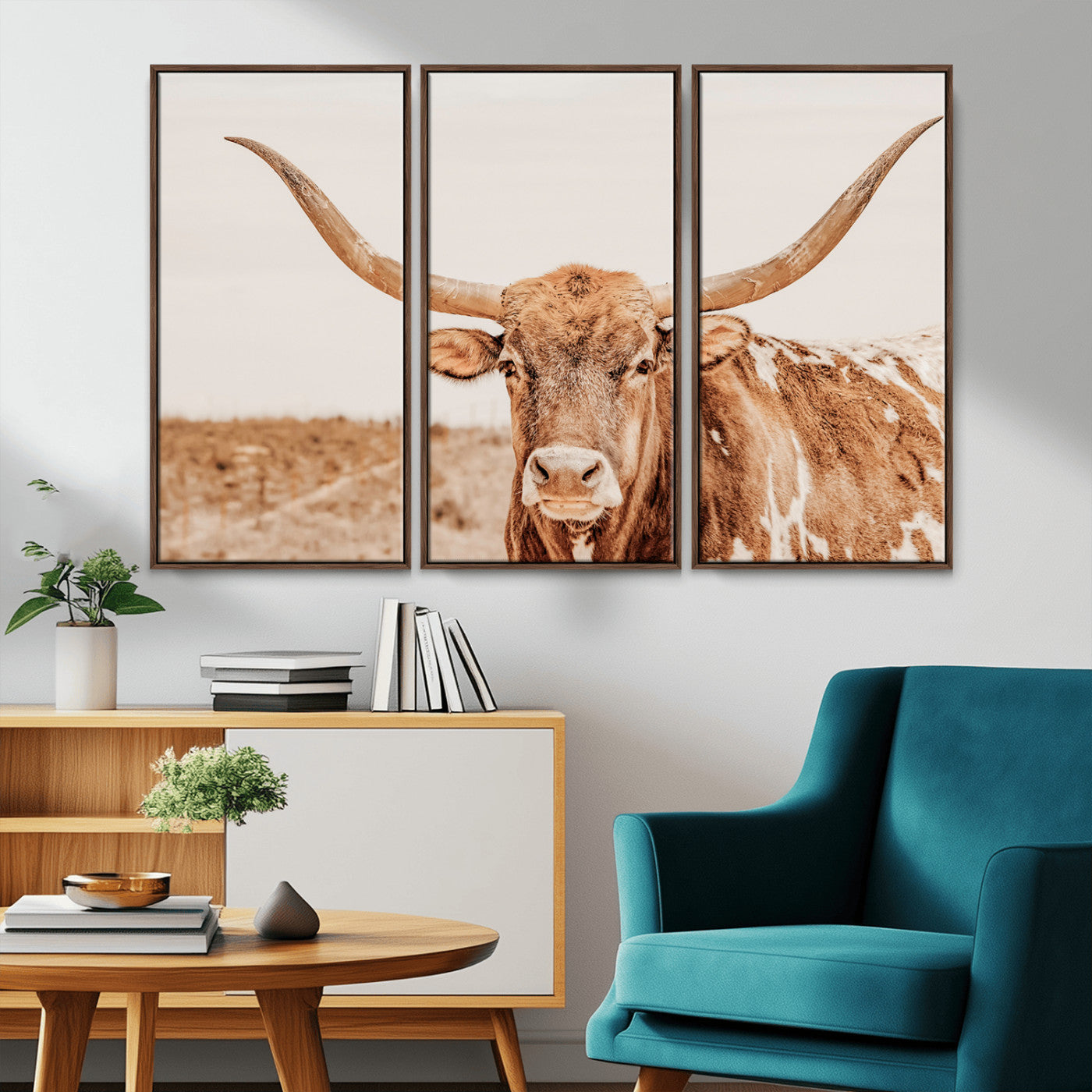 A longhorn bull standing proudly in a sunlit desert field with warm neutral tones, ideal for rustic western or farmhouse interiors.