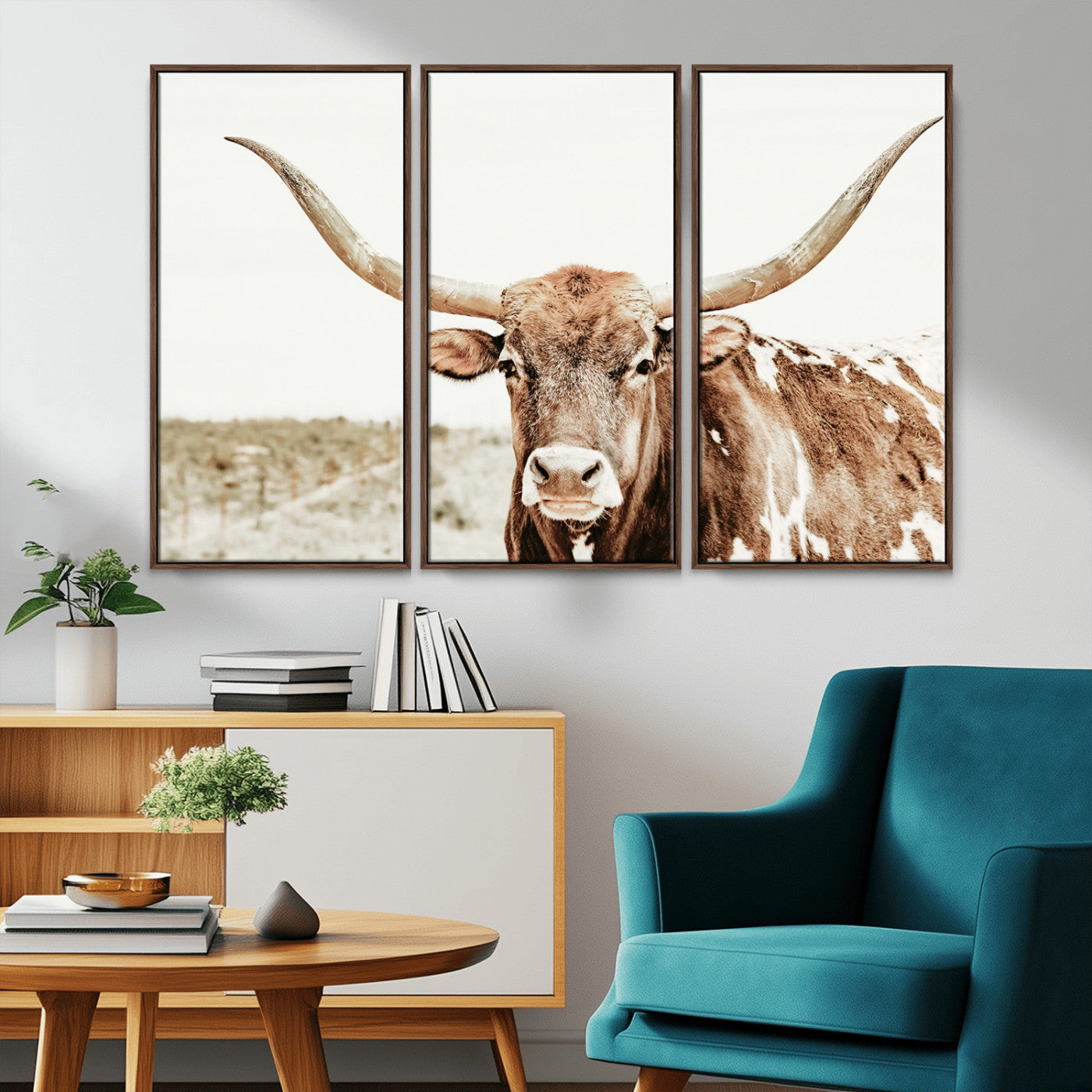 A Texas longhorn bull with wide horns, standing in a dry field under soft light, ideal for rustic farmhouse or western-themed interiors.