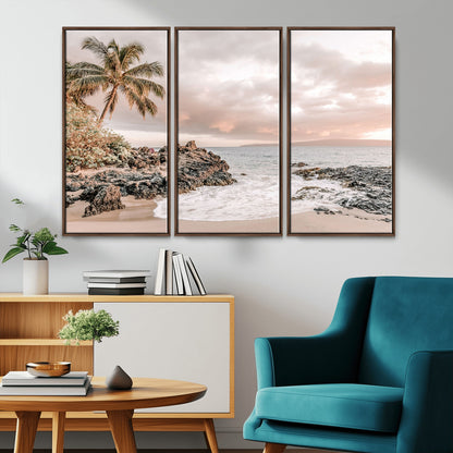 A peaceful beach scene with a palm tree and rocks, soft waves washing onto the shore under a soft pastel sky at sunset.