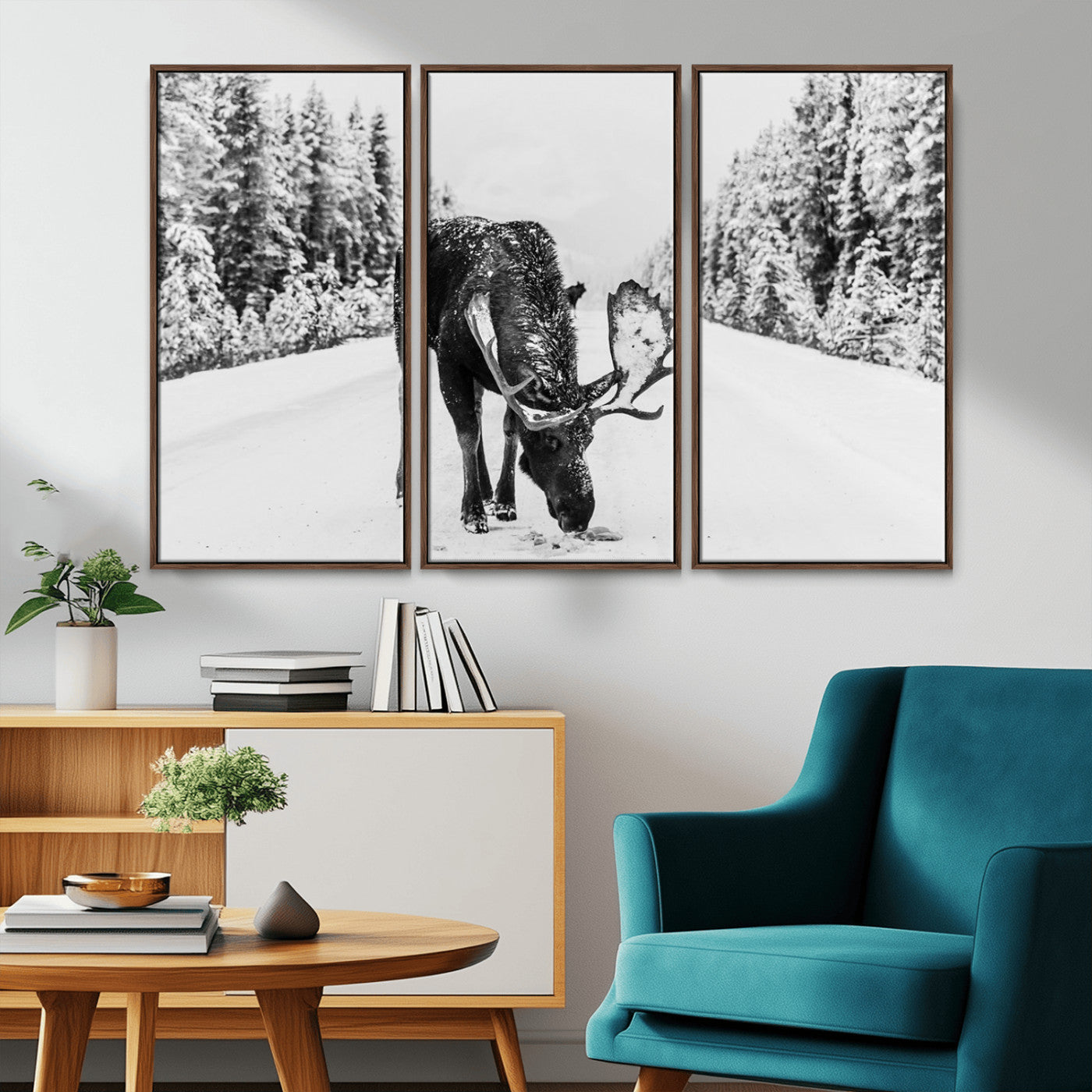 A majestic moose grazing in the snow-covered wilderness, surrounded by snow-covered trees, creating a peaceful winter scene.