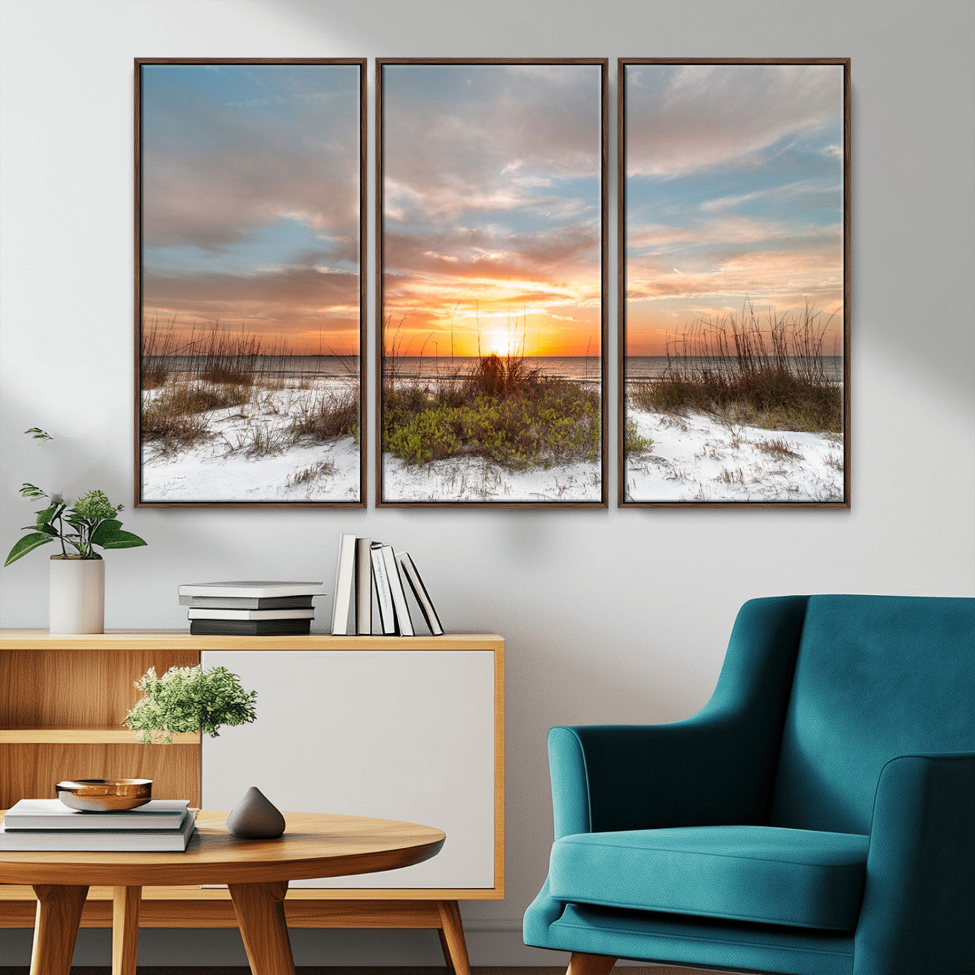 A tranquil beach scene featuring golden sunset hues over the water, with grasses in the foreground and a peaceful, serene atmosphere.