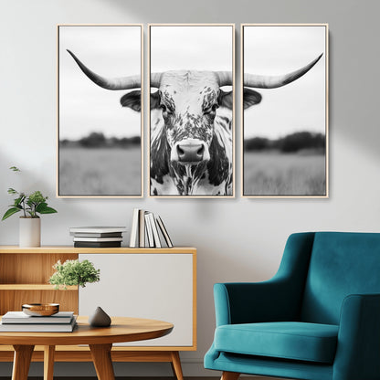 Capture the strength and elegance of nature with this striking black and white portrait of a longhorn cow. Its powerful presence makes a bold statement in any room.