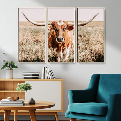Framed longhorn cow canvas wall art with rustic prairie background, western animal print perfect for farmhouse or ranch style decor