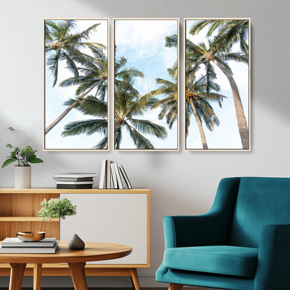 Framed canvas of tall palm trees reaching into a tropical sky, ideal for beach home or relaxed island-inspired wall decor.