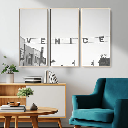 Black and white photo of Venice Beach sign and palm-lined street, perfect for urban coastal or minimalist LA-inspired wall decoration.