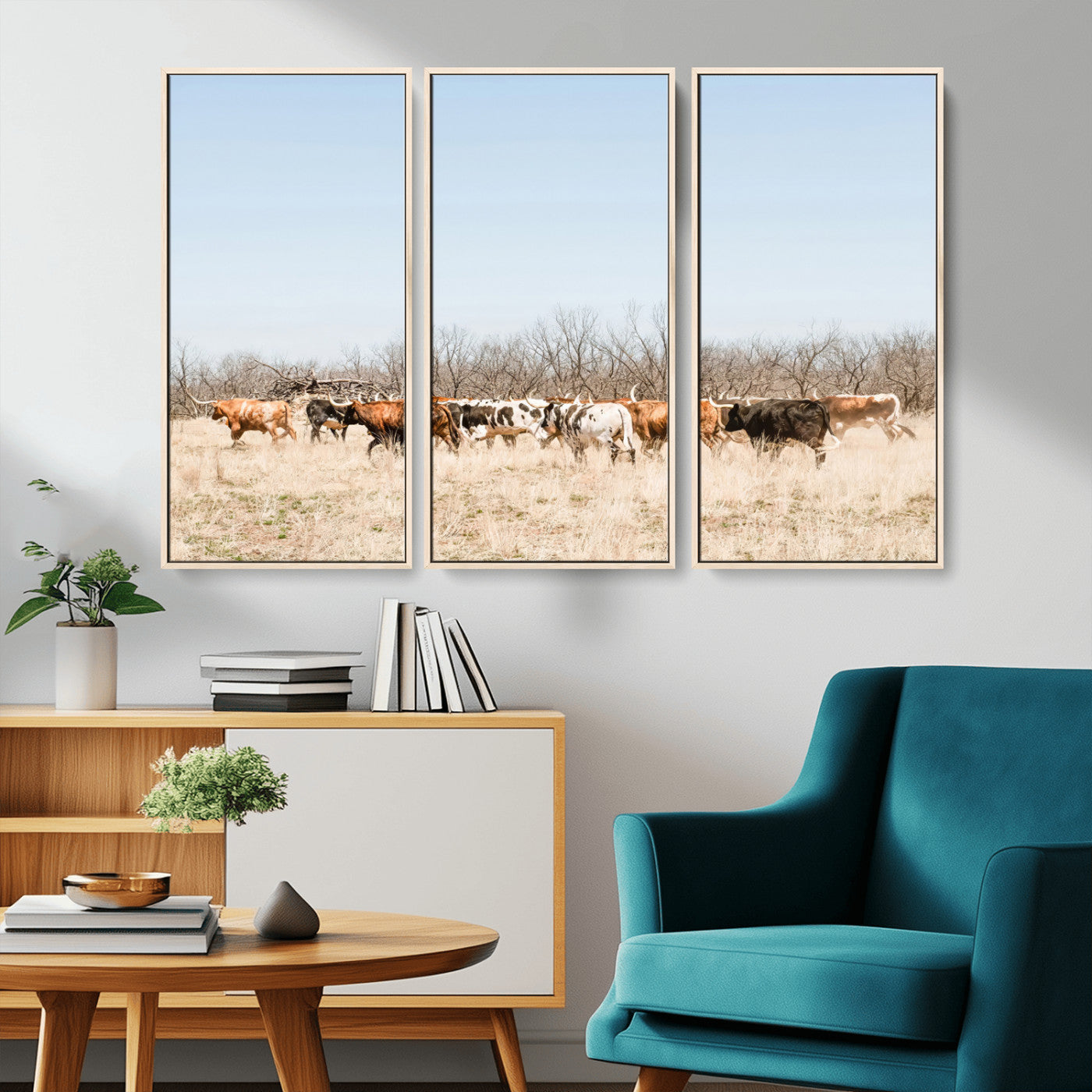 Framed wall art of Texas longhorn cattle walking through a dry, neutral-toned prairie, perfect for rustic farmhouse or western-themed home decor.