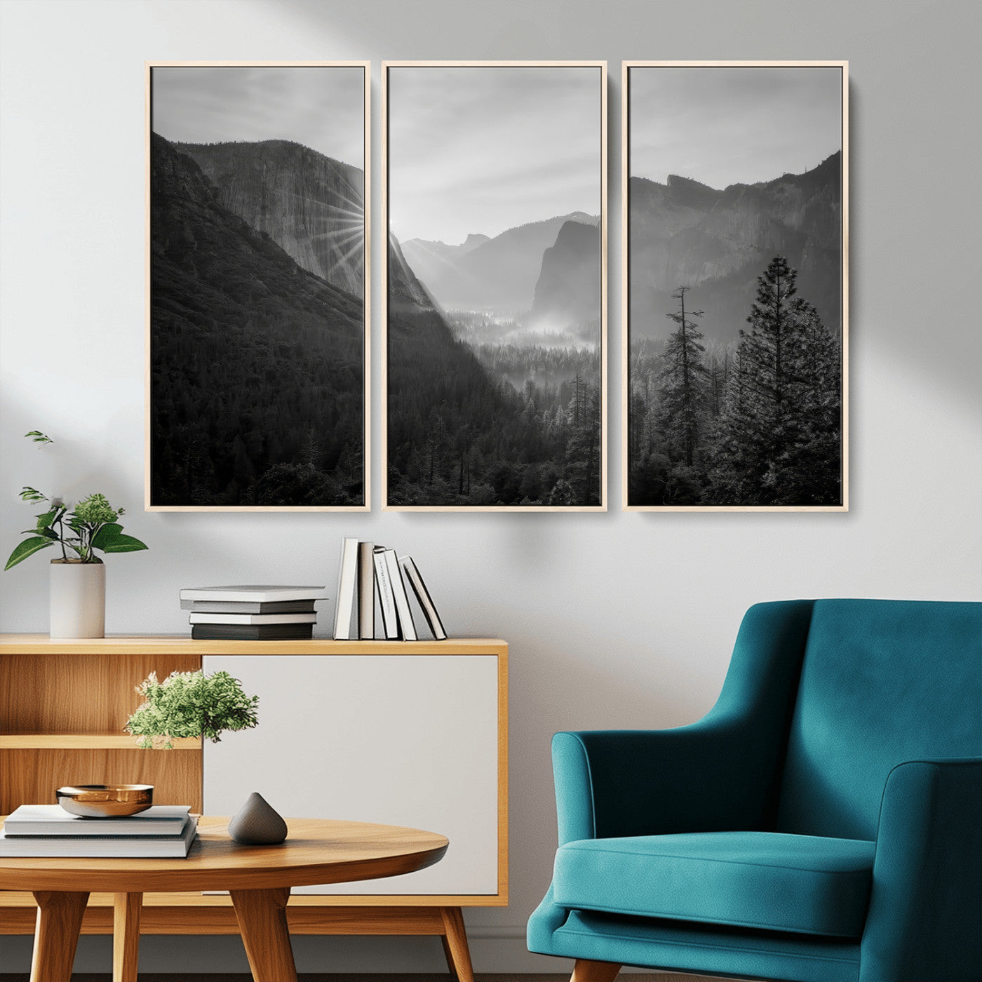 Black and white landscape of Yosemite with sun rays peeking over El Capitan, ideal for moody nature or modern rustic decor.