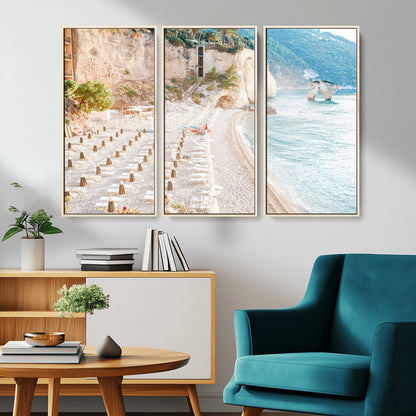 Wall art of a calm Mediterranean beach with rows of sun loungers and umbrellas in soft pastel tones, perfect for light coastal or vacation-themed decor.