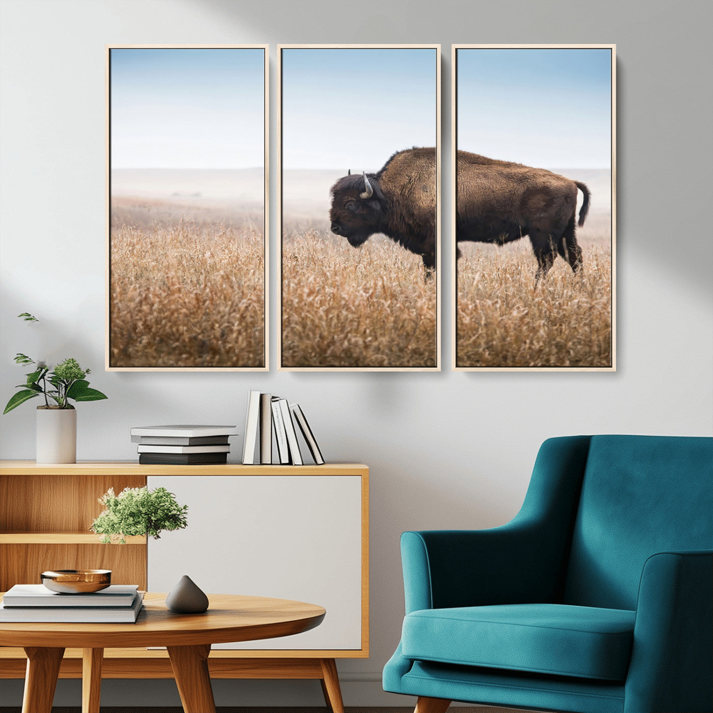 A majestic bison standing in an open prairie field, its strong form blending into the golden grass under a vast blue sky, evoking the wild spirit of the American plains.