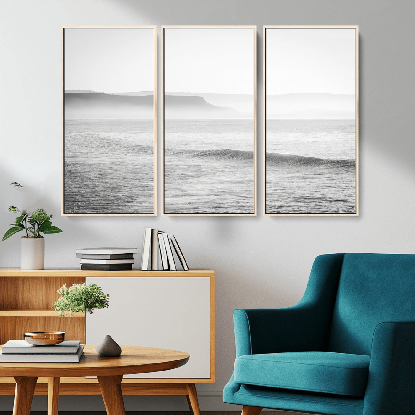 A black and white minimalist seascape featuring soft rolling waves and misty distant cliffs, creating a serene and timeless coastal atmosphere.