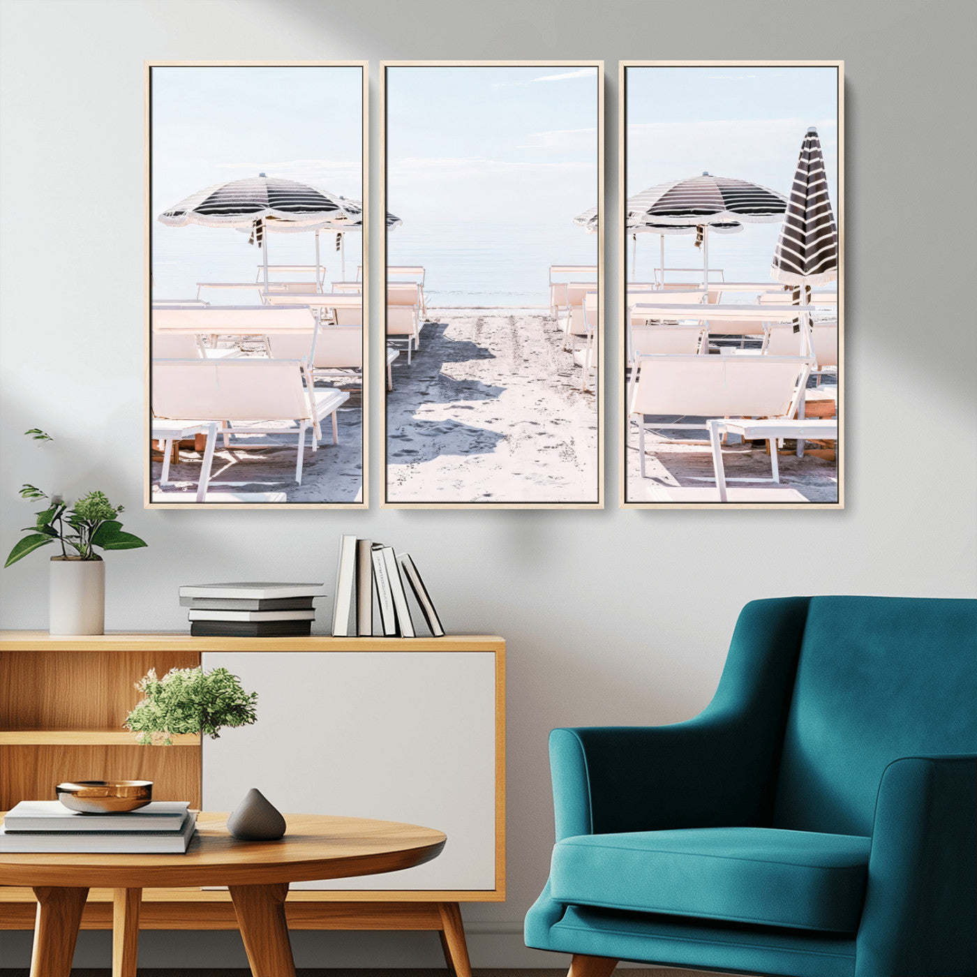 A serene minimalist beach scene featuring striped umbrellas, soft pastel sand, and an elegant lounge setup, creating a tranquil and stylish coastal retreat.