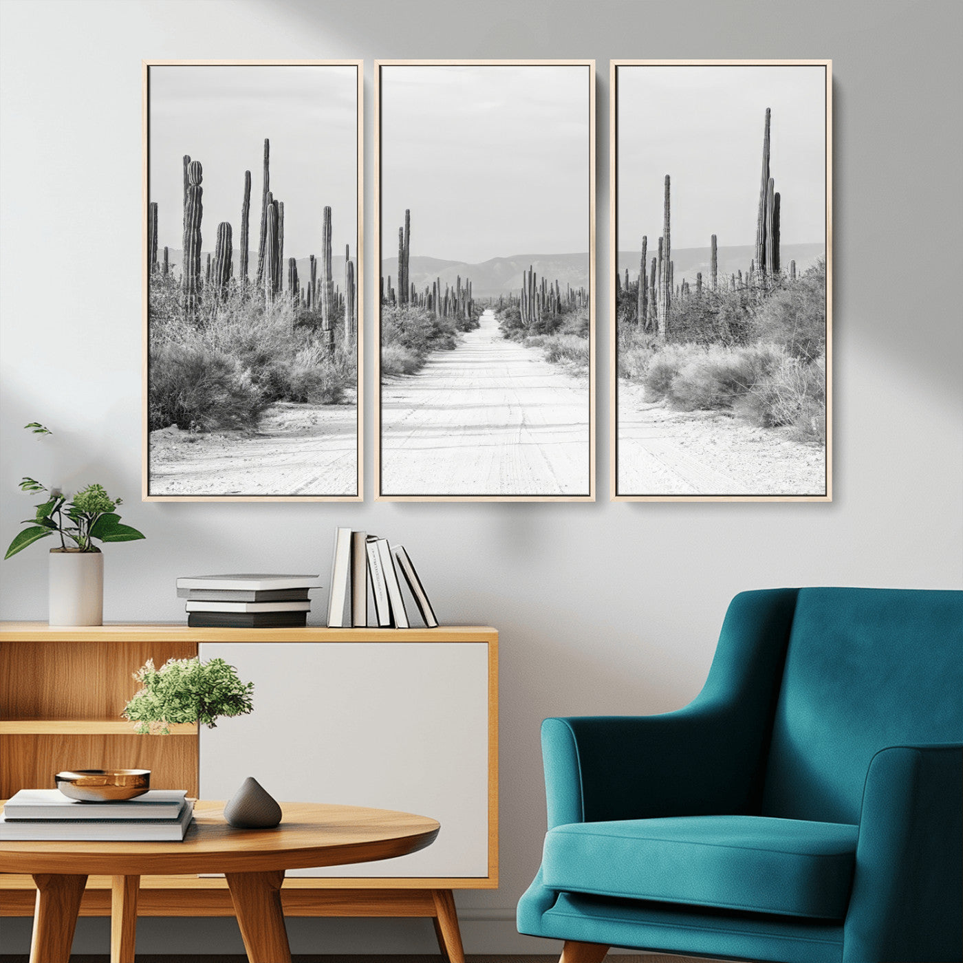 A black and white desert road stretching through a cactus-filled landscape, creating a rugged and timeless southwestern aesthetic with a sense of adventure.