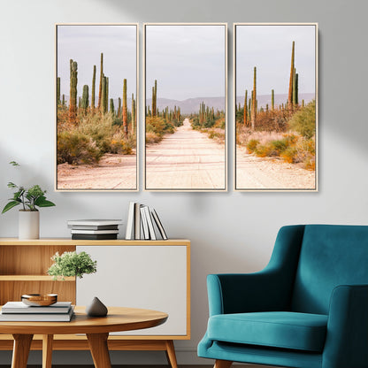 A desert road lined with saguaro cacti under a golden sky, creating a warm southwestern feel, perfect for boho or rustic decor.