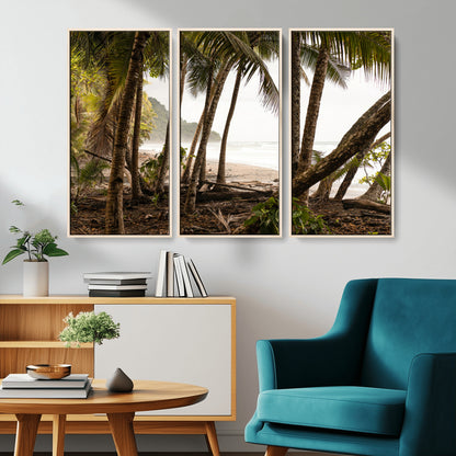 Dense tropical palm trees framing a sandy beach and ocean shore, ideal for jungle or coastal themed interior wall decor.
