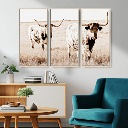 Two Texas longhorn cows standing in a sepia-toned pasture, evoking rustic charm perfect for farmhouse or western country interiors. (