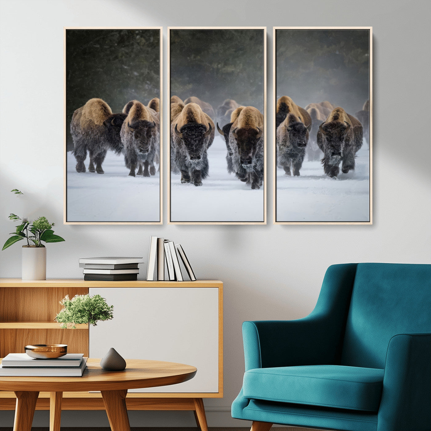 A herd of American bisons walking through deep snow in a forest, evoking a powerful rustic wilderness mood for western-style interiors.