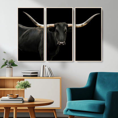 Close-up of a black Texas longhorn with large curved horns on black background, ideal for rustic farmhouse or modern western interiors.