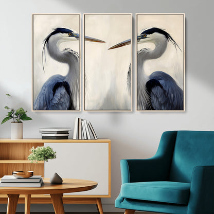 Two blue herons facing each other on a soft neutral background, ideal for coastal, tranquil, or nature-inspired minimalist interiors.