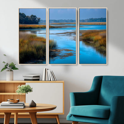 A peaceful marshland scene with calm blue water reflecting the surrounding grasses and trees, capturing the beauty of nature in a serene landscape.