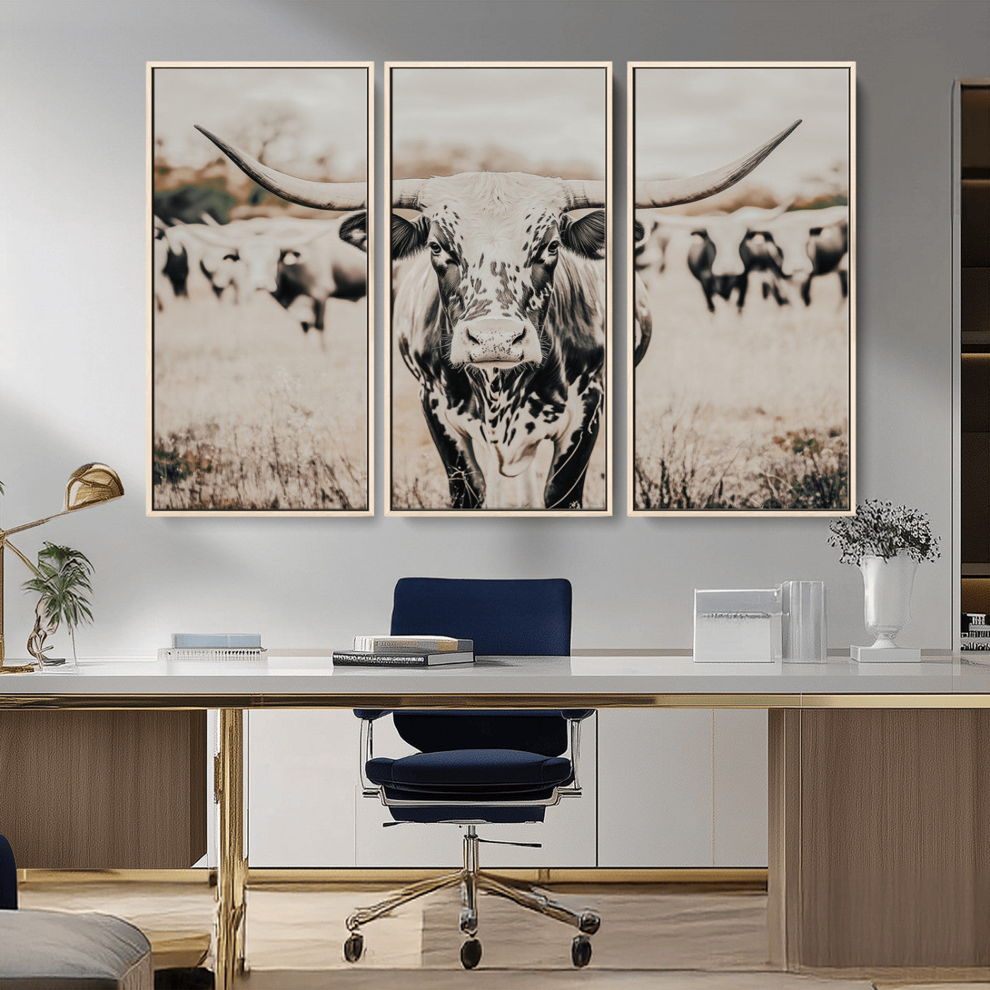 Canvas of a speckled Texas longhorn standing boldly in a field with a herd behind, perfect for rustic western or farmhouse wall decor.