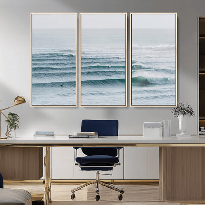 High-angle view of surfers lining up across layered ocean waves, ideal for minimal coastal or surf-inspired room decor.
