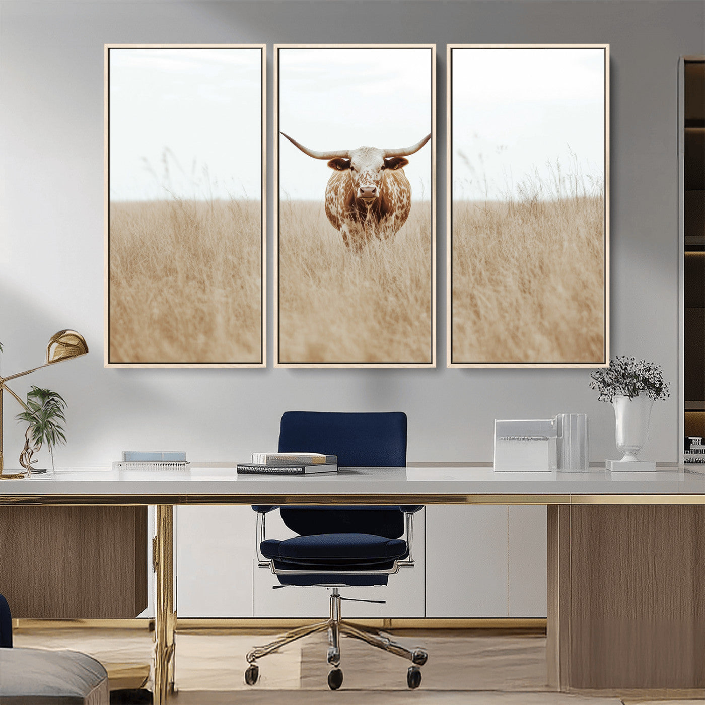 Texas Longhorn bull standing alone in dry grass with neutral tones, ideal for rustic western or cowboy-themed wall decor.