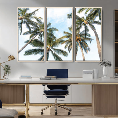 Framed canvas of tall palm trees reaching into a tropical sky, ideal for beach home or relaxed island-inspired wall decor.