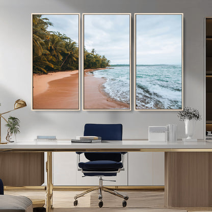 Framed canvas of a tropical beach with palm trees and soft waves, ideal for coastal escape or serene nature-inspired home decor.