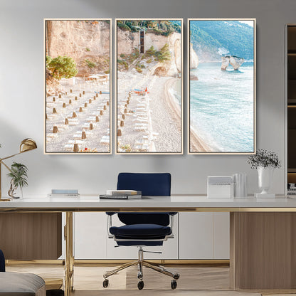 Wall art of a calm Mediterranean beach with rows of sun loungers and umbrellas in soft pastel tones, perfect for light coastal or vacation-themed decor.