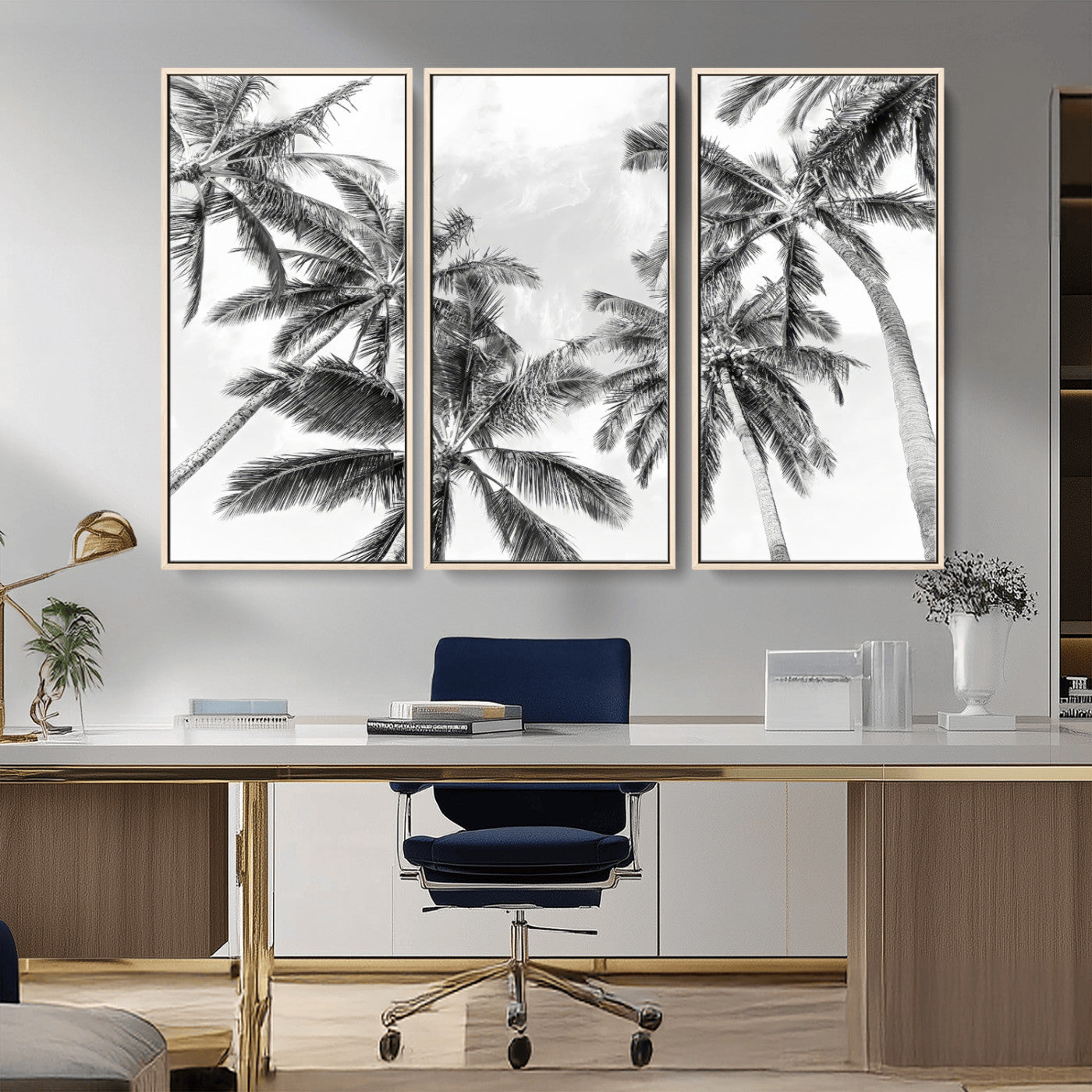 Black and white tropical palm trees viewed from below, swaying gently against a bright sky, creating a serene and elegant coastal atmosphere.