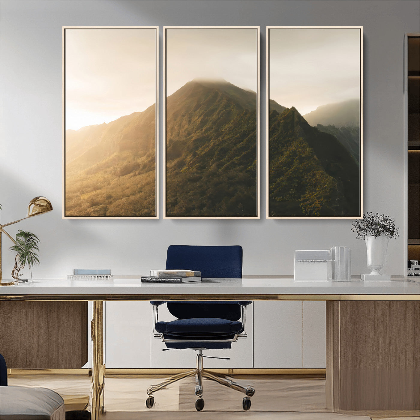 Sunlit mountain peak with mist rolling over its rugged slopes, bathed in golden light, creating a warm and tranquil nature-inspired scene.