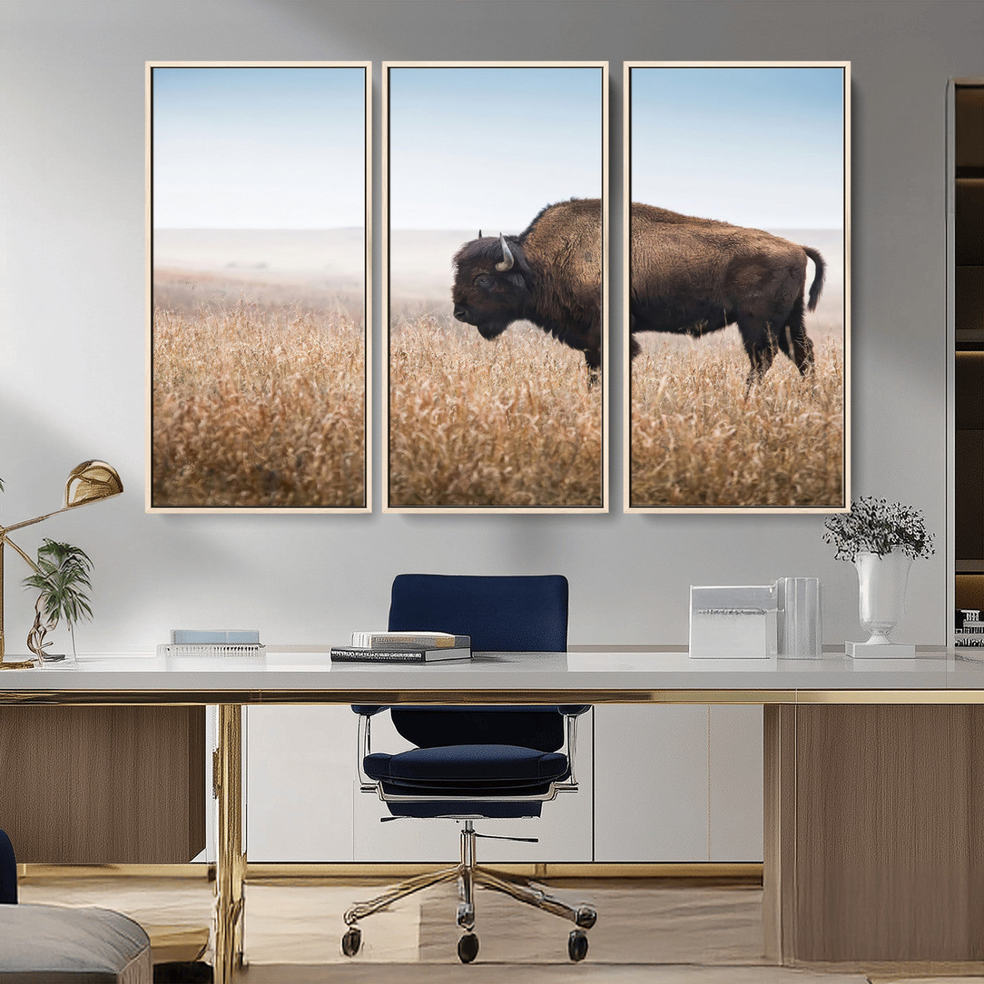 A majestic bison standing in an open prairie field, its strong form blending into the golden grass under a vast blue sky, evoking the wild spirit of the American plains.
