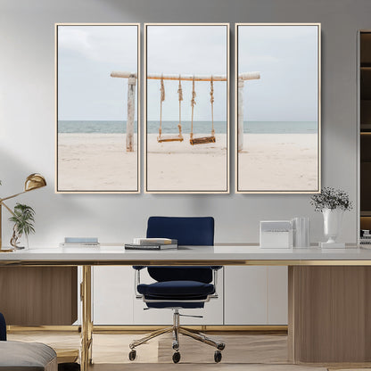 A rustic wooden beach swing stands on a serene sandy shore with an ocean horizon in the background, creating a tranquil and dreamy coastal escape.