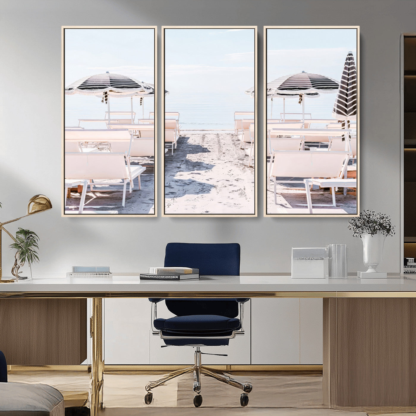 A serene minimalist beach scene featuring striped umbrellas, soft pastel sand, and an elegant lounge setup, creating a tranquil and stylish coastal retreat.