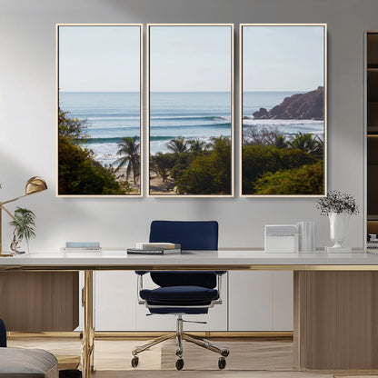 View of calm ocean waves with palm trees and a tropical coastline, ideal for coastal boho or beach-themed wall decor.