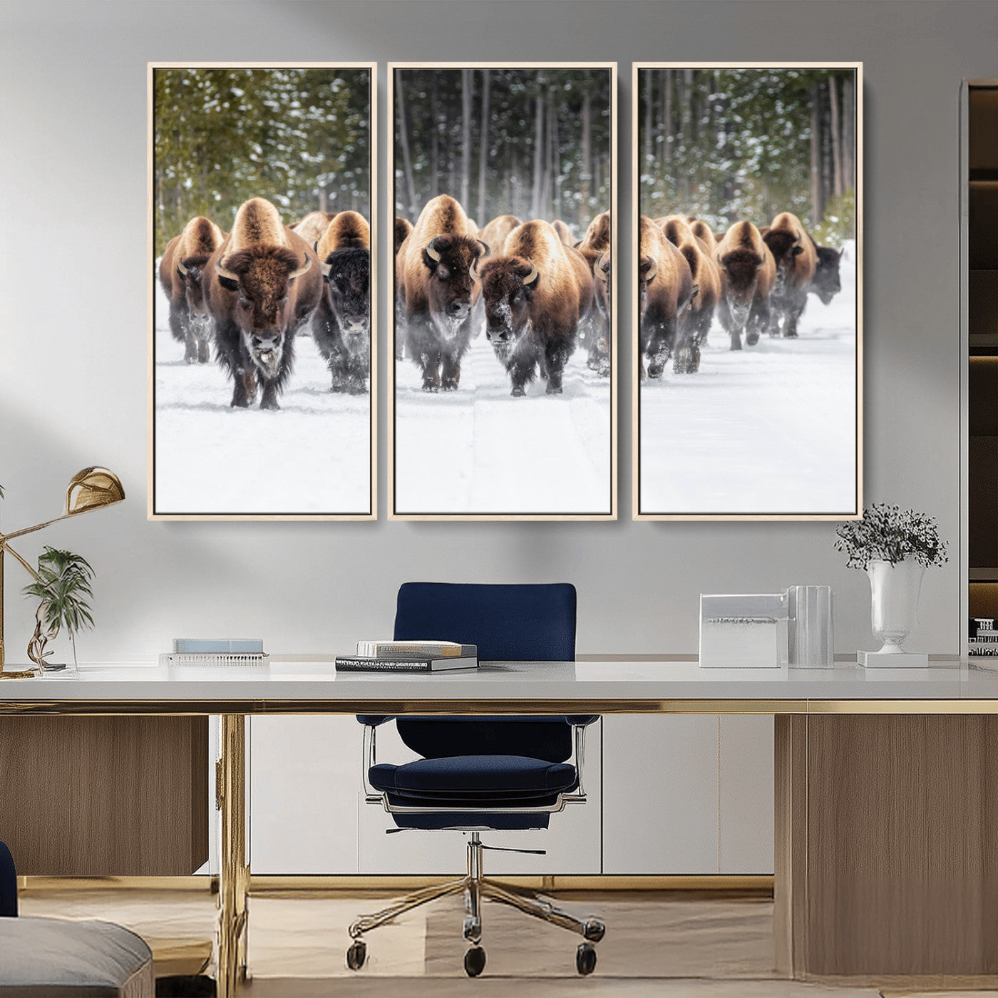 A herd of American bisons walking through a snowy forest path, perfect for rustic cabin or Western-themed wall decor.