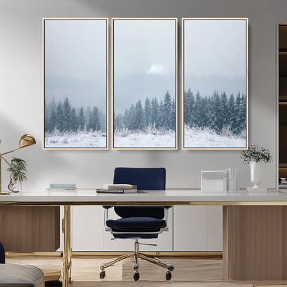 Snow-covered forest under misty sky, soft light breaking through clouds, ideal for minimalist or Nordic-inspired home decor.