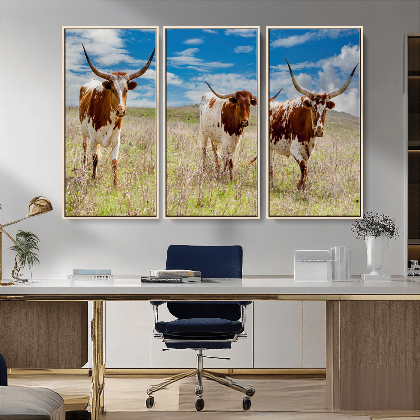 Three Texas longhorn cattle standing in dry grass under a bright blue sky, ideal for farmhouse or western rustic home decor.