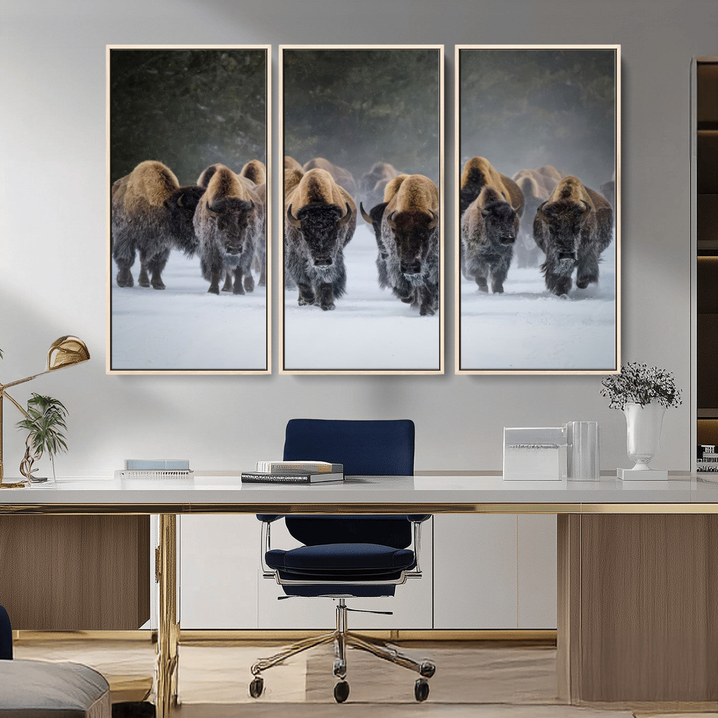 A herd of American bisons walking through deep snow in a forest, evoking a powerful rustic wilderness mood for western-style interiors.