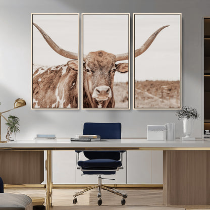 A longhorn cow in soft beige desert tones, standing calmly in open land, perfect for neutral western or rustic farmhouse interiors.