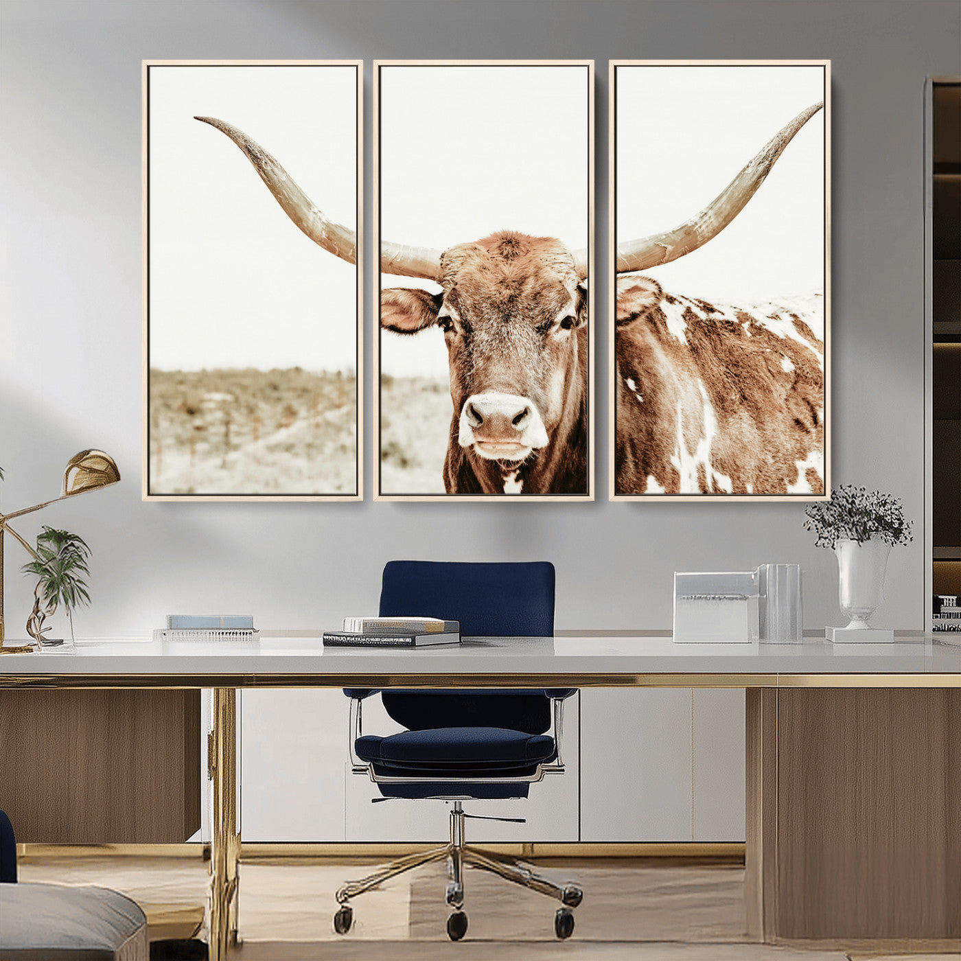 A Texas longhorn bull with wide horns, standing in a dry field under soft light, ideal for rustic farmhouse or western-themed interiors.