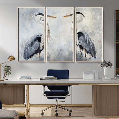 Two herons facing each other on a soft-toned background with blue-grey feathers, perfect for tranquil, coastal or nature-themed interiors.
