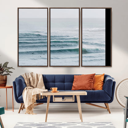 High-angle view of surfers lining up across layered ocean waves, ideal for minimal coastal or surf-inspired room decor.