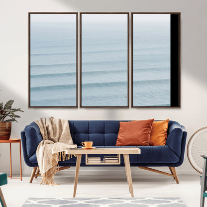 Framed canvas of repeating ocean waves with a distant solo surfer, ideal for minimalist ocean or calm coastal wall decor.