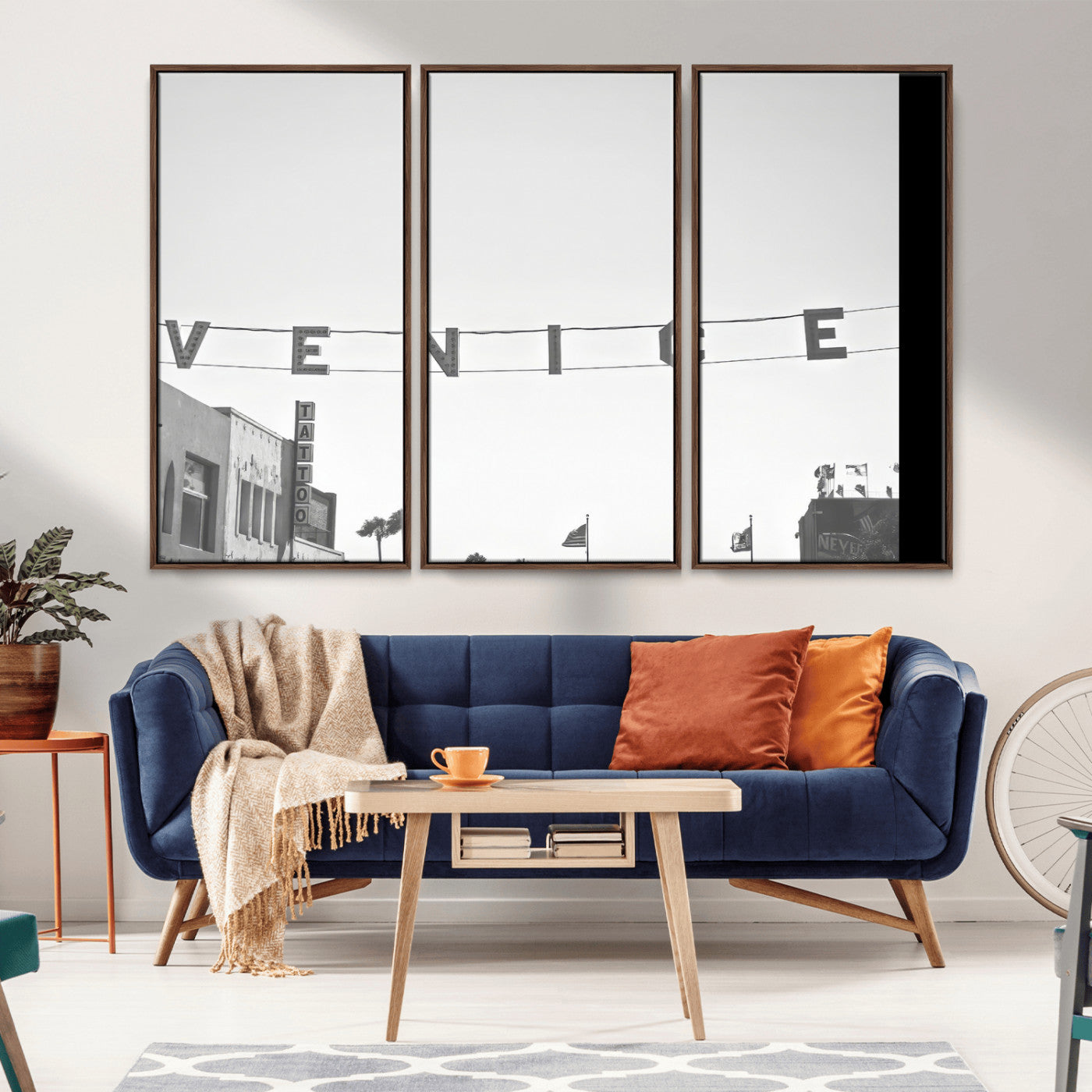 Black and white photo of Venice Beach sign and palm-lined street, perfect for urban coastal or minimalist LA-inspired wall decoration.