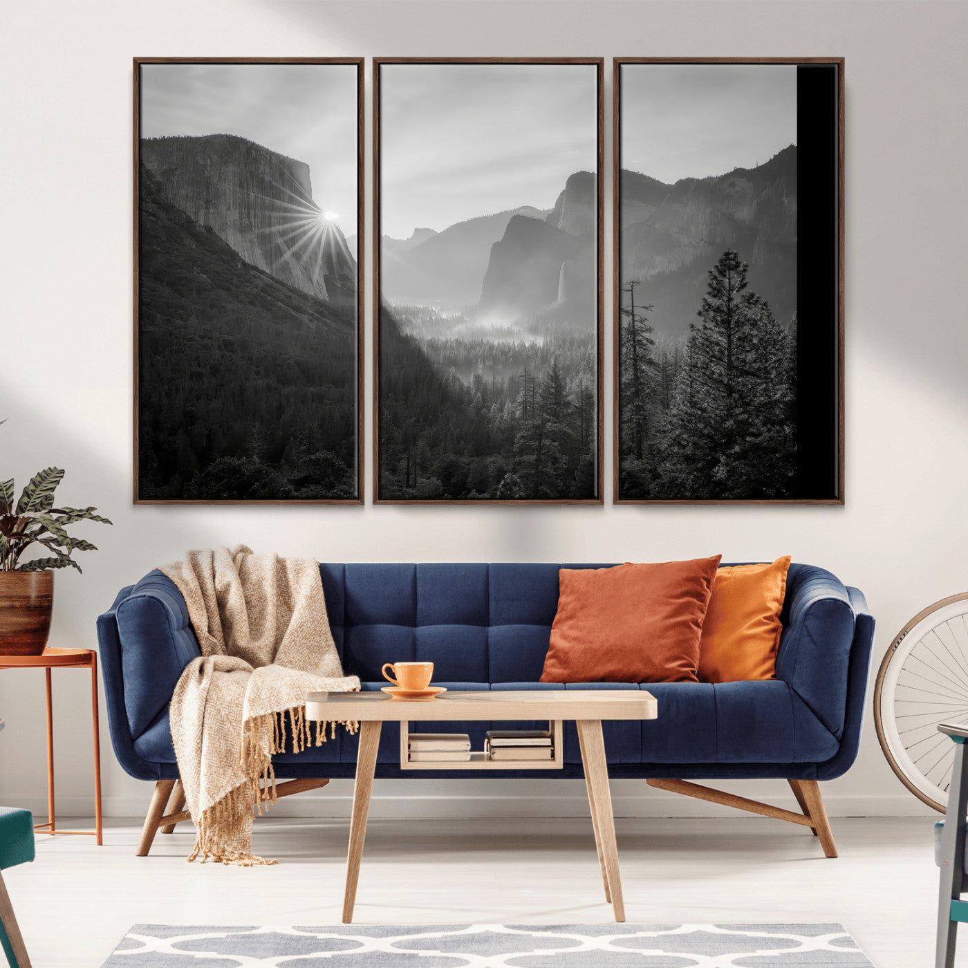 Black and white landscape of Yosemite with sun rays peeking over El Capitan, ideal for moody nature or modern rustic decor.