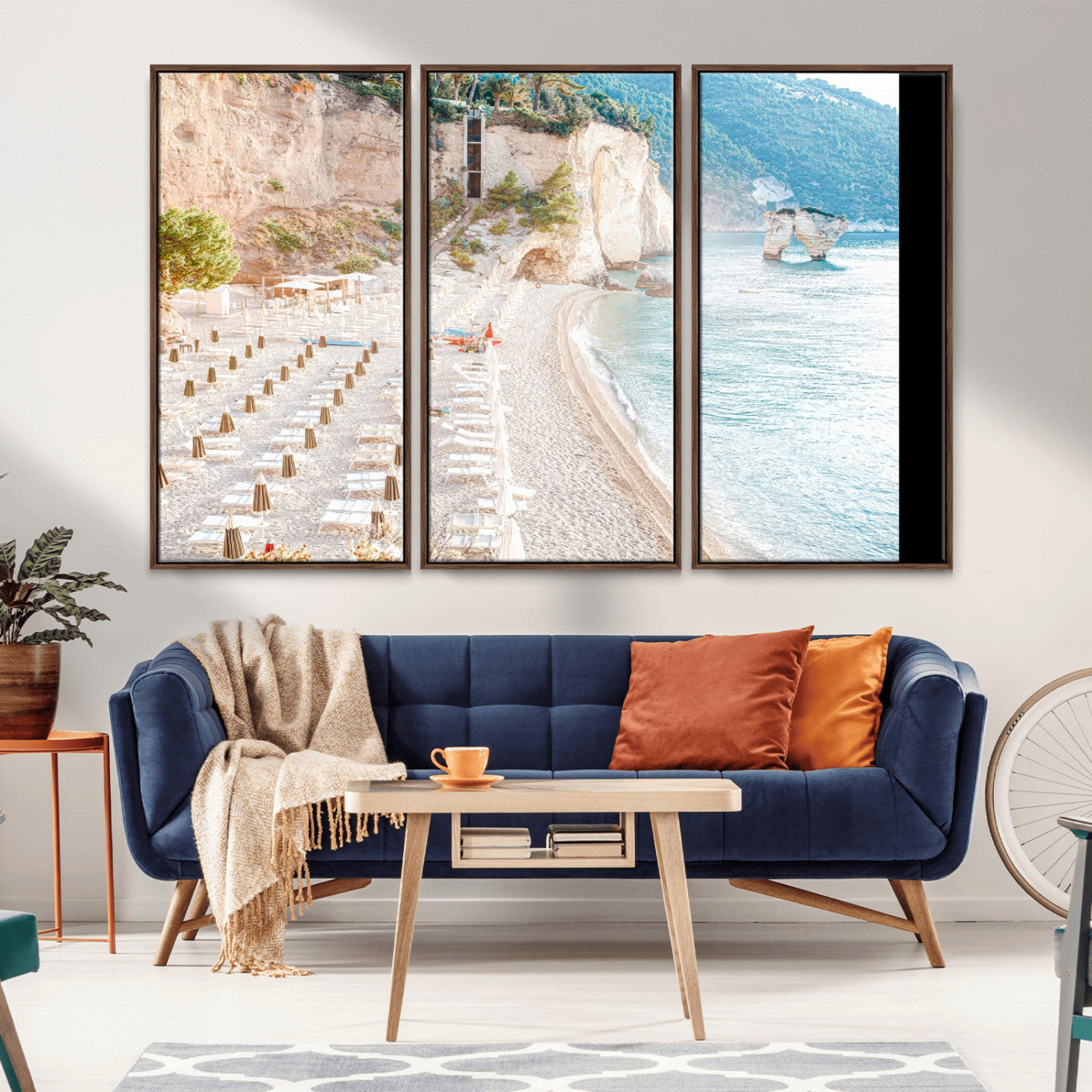 Wall art of a calm Mediterranean beach with rows of sun loungers and umbrellas in soft pastel tones, perfect for light coastal or vacation-themed decor.